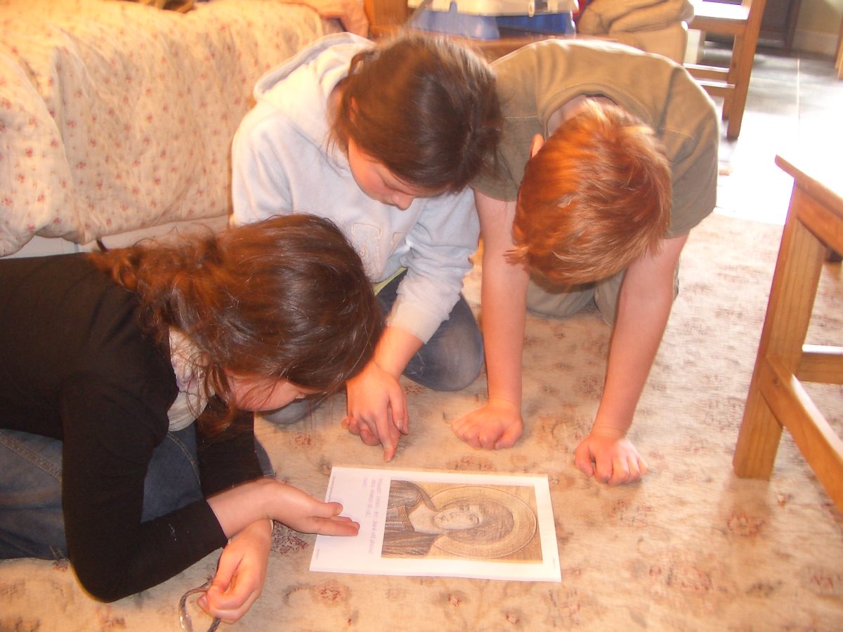 Three children learning about Cimabue