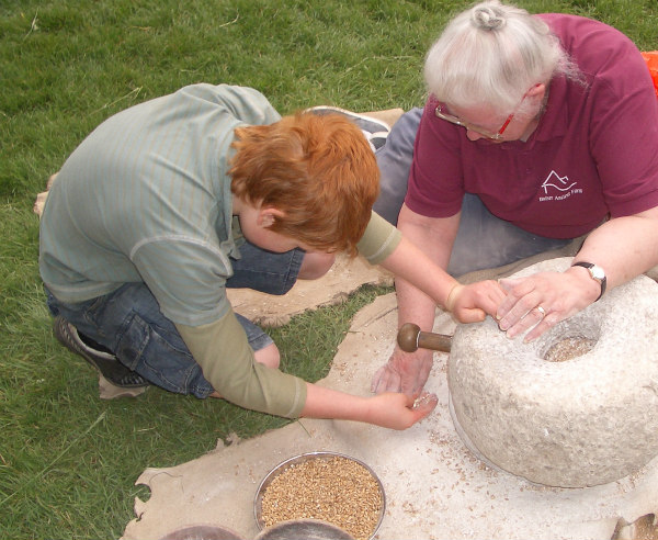 Butser Farm-celts-homeschool-field trip-grinding grain to flour
